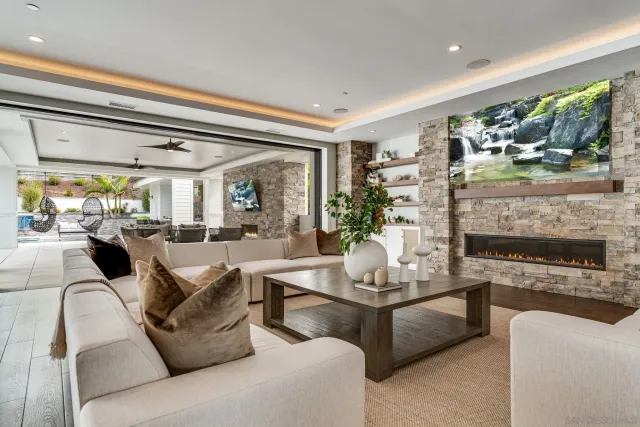 a kitchen with a sink and chairs