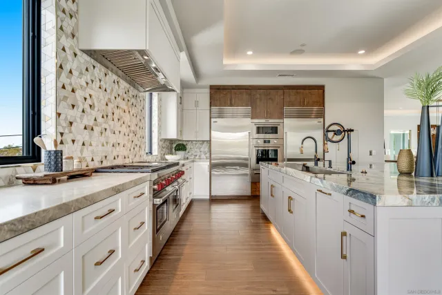 a view of a dining room with furniture large windows and wooden floor