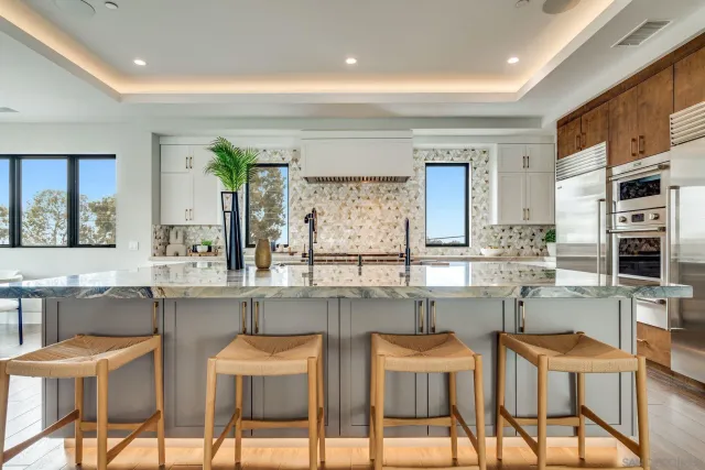 a bedroom with a large bed and a large window