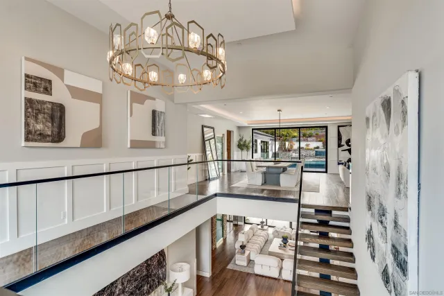 a bed room with a bed and a chandelier