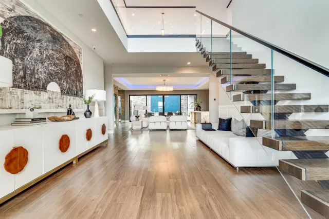 a living room with furniture and wooden floor