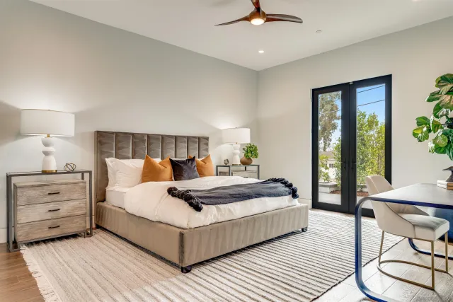 a bathroom with a sink mirror and toilet