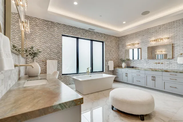 a view of a kitchen with a stove and a kitchen island