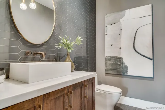 a view of a patio with dining table and chairs with a barbeque
