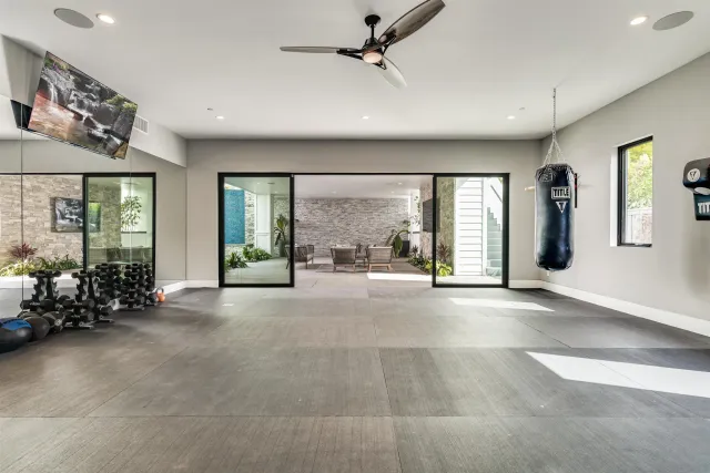 a view of swimming pool with outdoor seating and plants