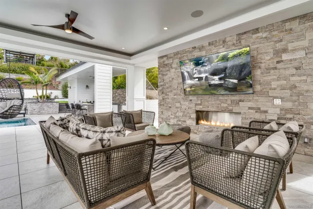 a bathroom with a granite countertop sink and a potted plant