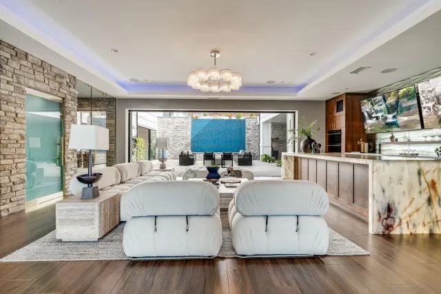 a living room with furniture and a large window