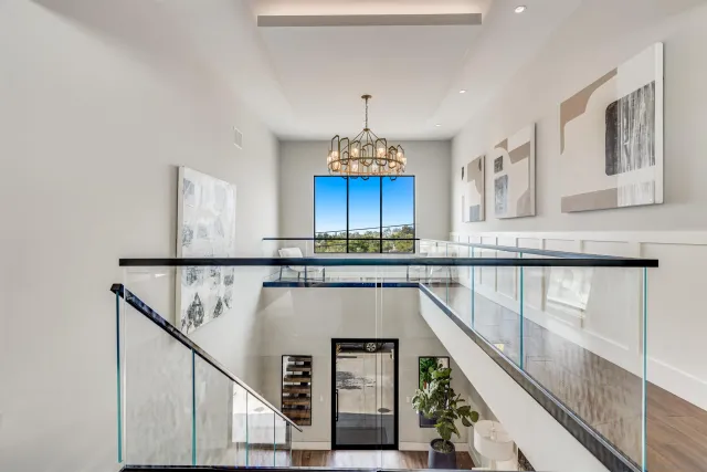 a living room with fireplace furniture and a large window