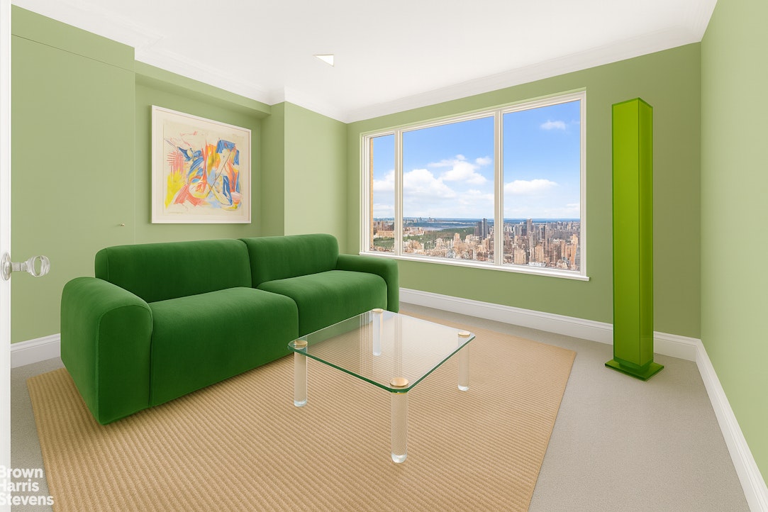 200 East 69th Street, Unit 47 Manhattan, NY 10021 - Photo 15 of 29 a living room with furniture and a large window