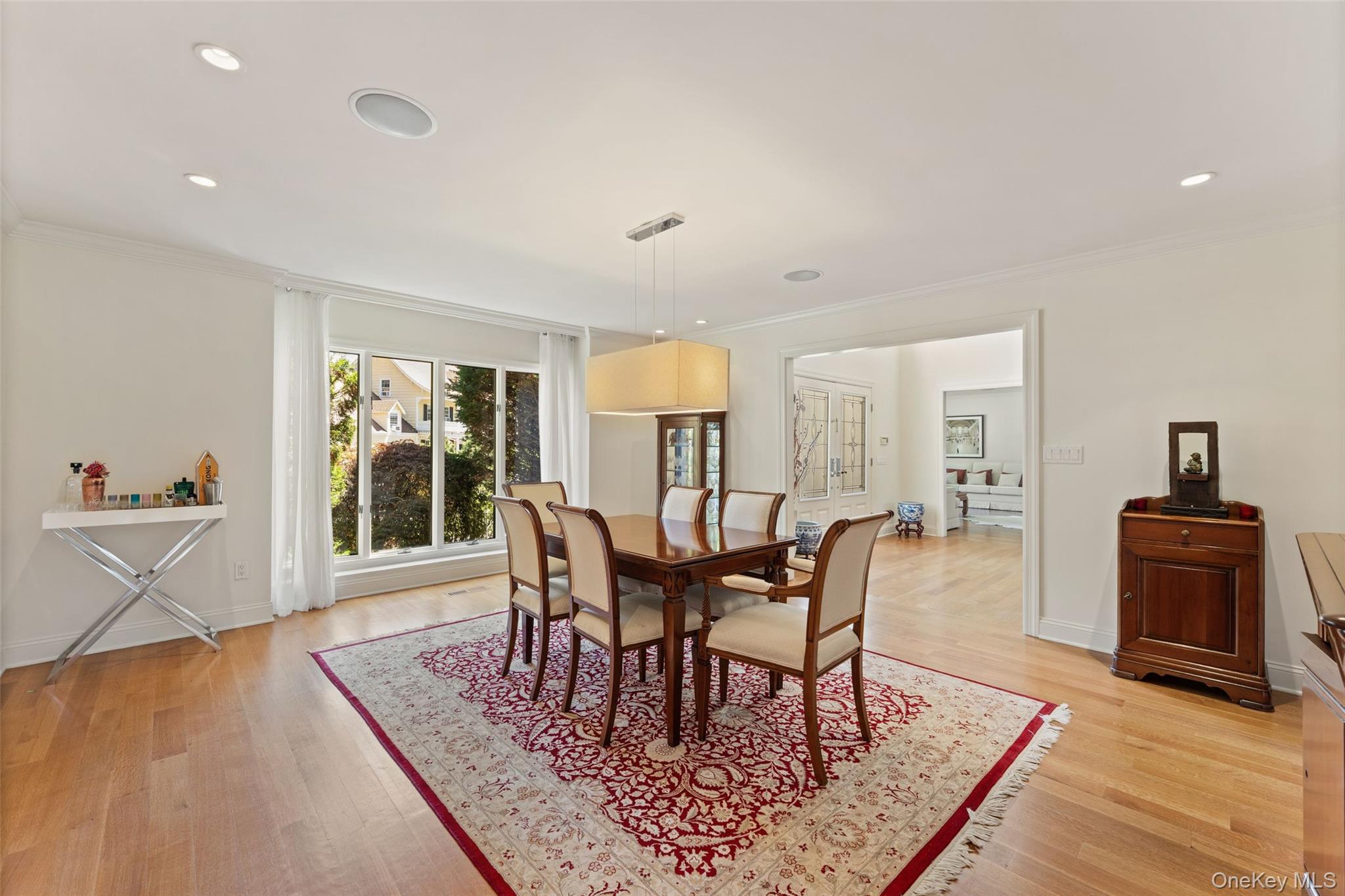 6 Magnetti Circle Mamaroneck, NY 10543 - Photo 8 of 24 a view of a dining room with furniture window and wooden floor