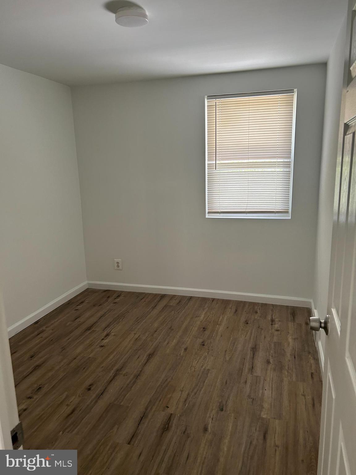 126 Fronefield Avenue Linwood, PA 19061 - Photo 9 of 15 an empty room with wooden floor and windows