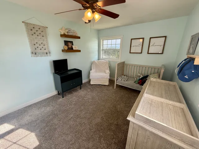 a bedroom with furniture and window