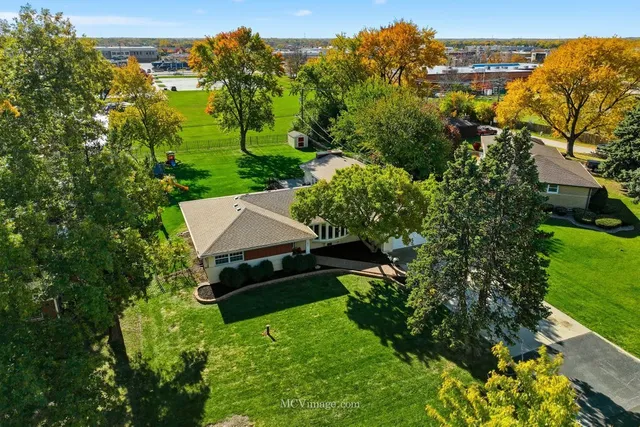 an aerial view of a house with mountain view
