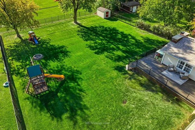 a backyard of a house with lots of green space