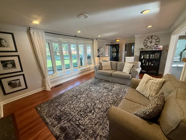 a living room with furniture and a rug