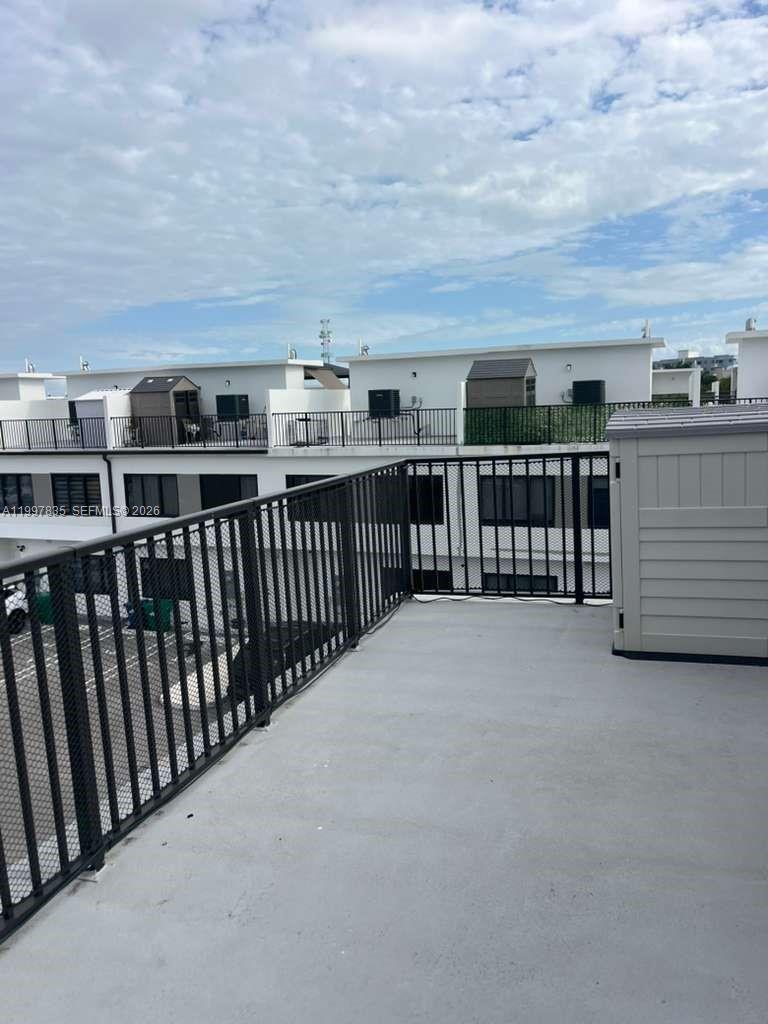 14561 Southwest 261st Terrace, Unit 1 Homestead, FL 33032 - Photo 12 of 13 a view of a balcony with city