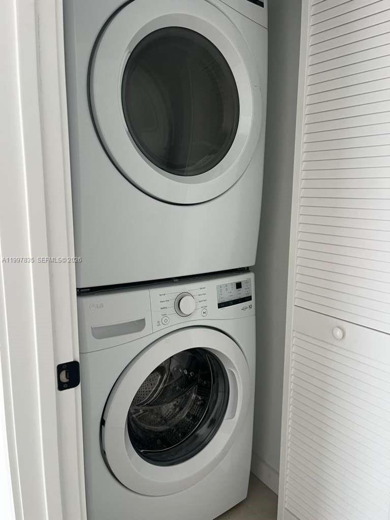 14561 Southwest 261st Terrace, Unit 1 Homestead, FL 33032 - Photo 13 of 13 a utility room with dryer and washer