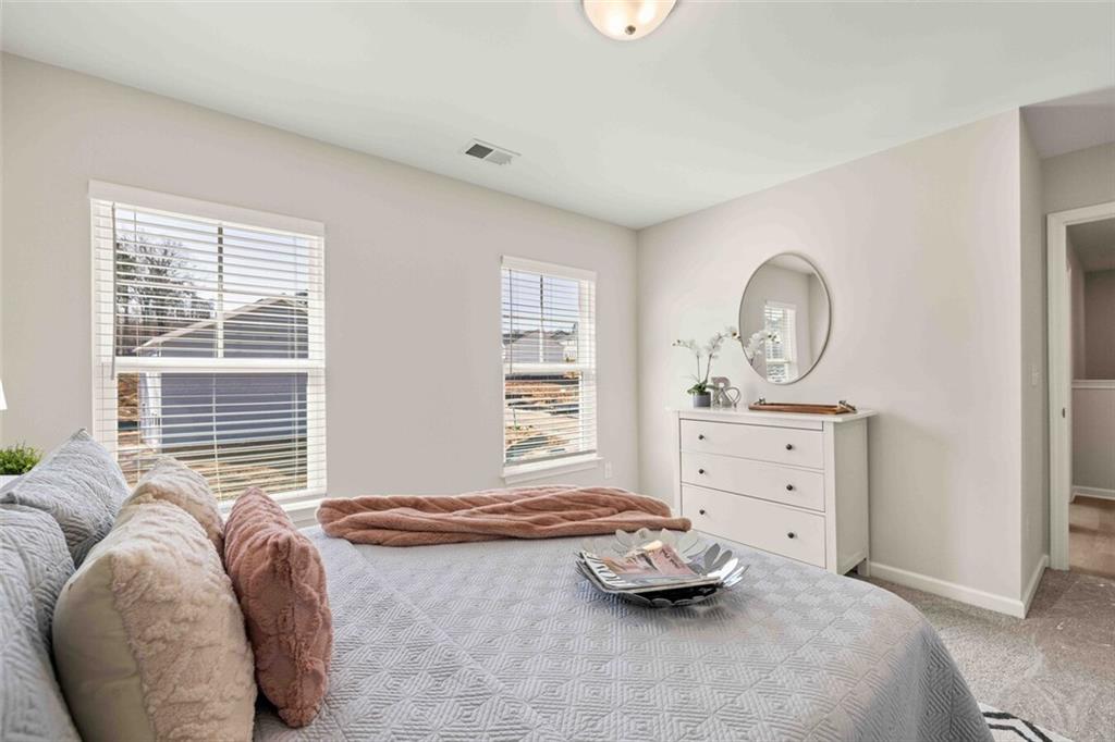 3489 Fairview Road, Unit MAGNOLIA Covington, GA 30016 - Photo 22 of 29 a bedroom with furniture and a window
