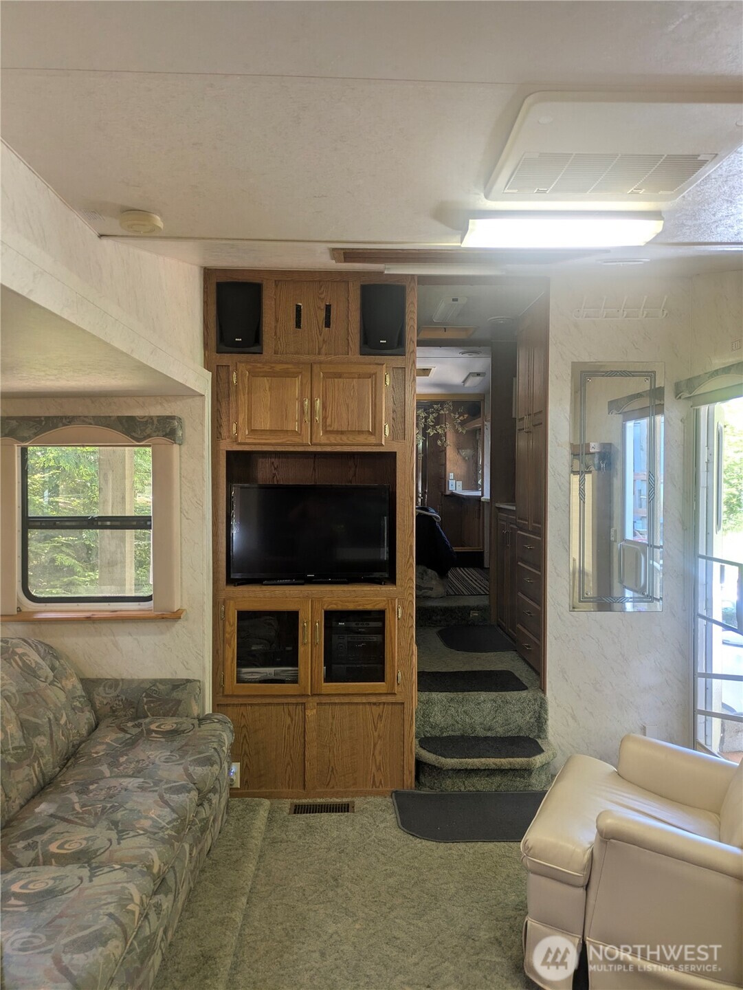 44957 Kachess Trail, Unit 2C97 Concrete, WA 98237 - Photo 7 of 16 a living room with furniture and a fireplace