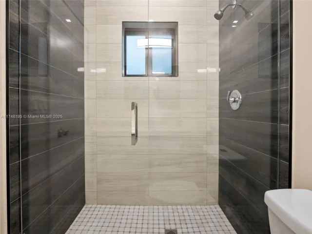 a view of a house with a tree in the background