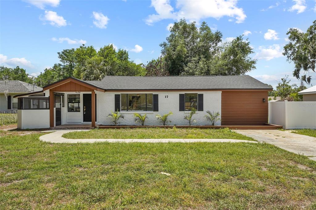 17 Palmira Road DeBary, FL 32713 - Photo 3 of 28 a front view of a house with a porch