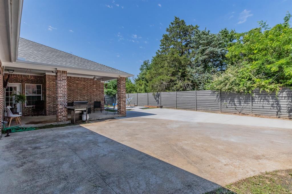 1818 Ebbtide Lane Dallas, TX 75224 - Photo 14 of 33 a view of a backyard and basketball court