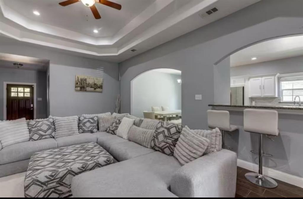 1818 Ebbtide Lane Dallas, TX 75224 - Photo 6 of 33 a living room with furniture and a view of kitchen