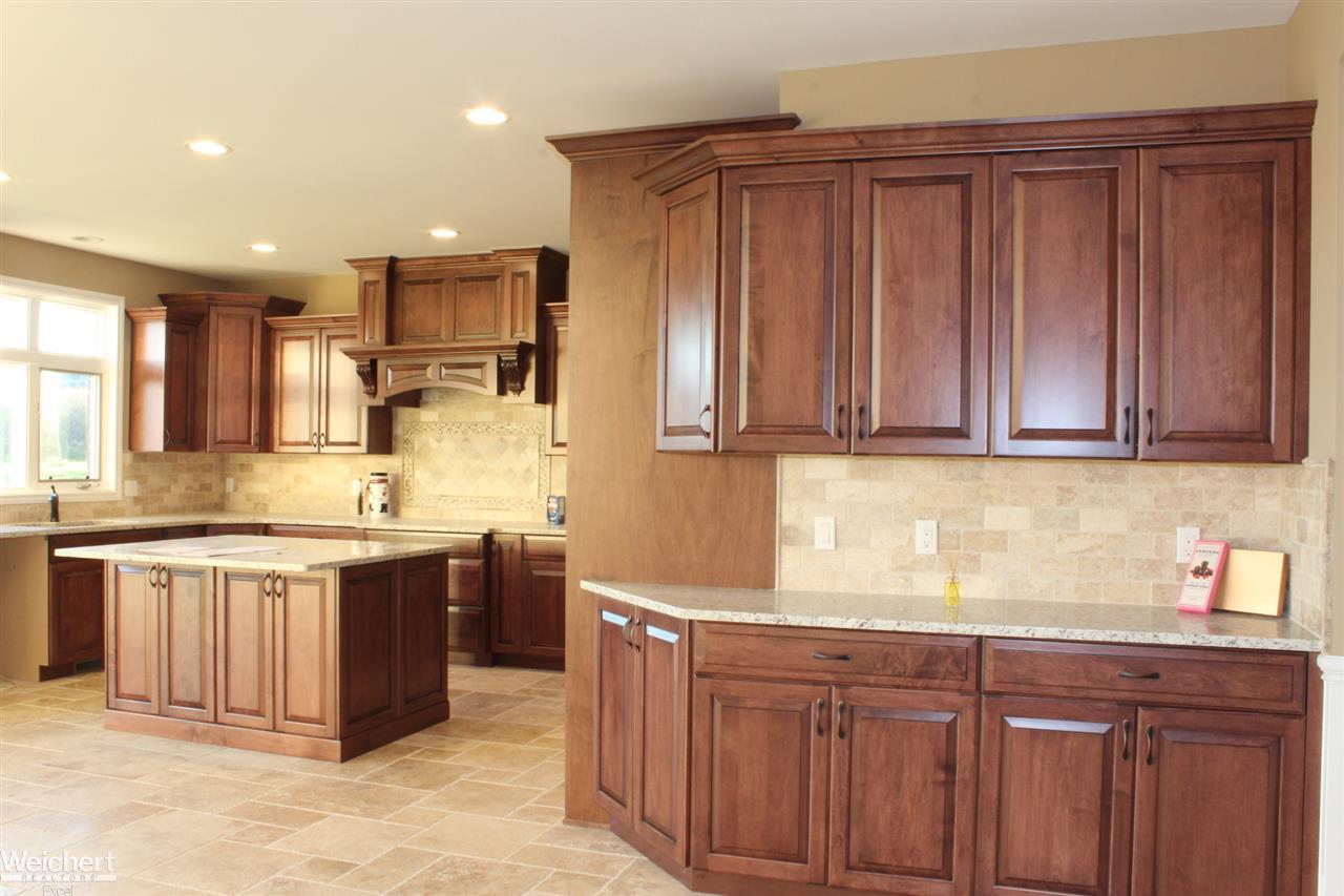 8812 Ridge Drive Washington, MI 48095 - Photo 13 of 44 Lafata Cabinets, Granite counters and Travertine Floor & Backsplash