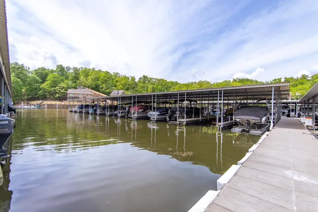 a view of a lake with a house in the background