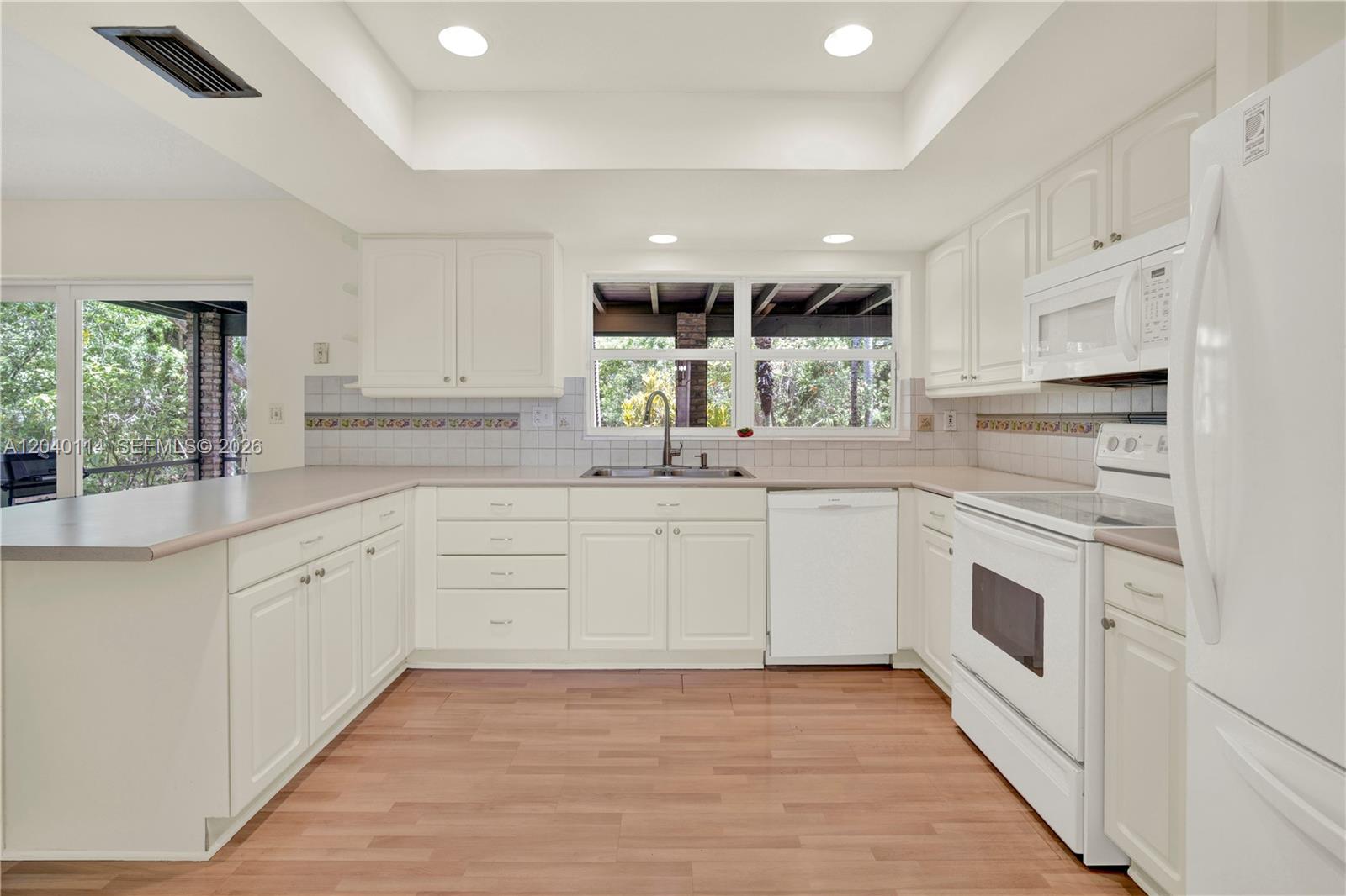 10435 Southwest 96th Street Miami, FL 33176 - Photo 12 of 44 Light and bright white kitchen 11' x 12.9'