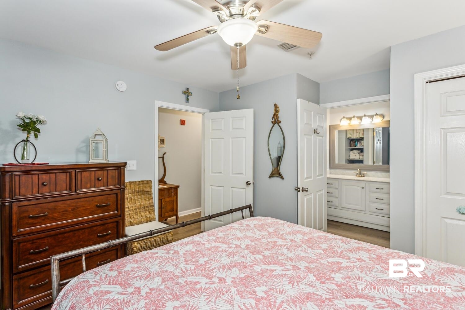 13551 Johnson Beach Road, Unit 112E Pensacola, FL 32507 - Photo 16 of 42 Bedroom with ceiling fan, sink, and connected bathroom