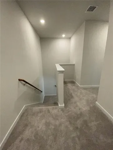 a bathroom with a sink toilet vanity and mirror