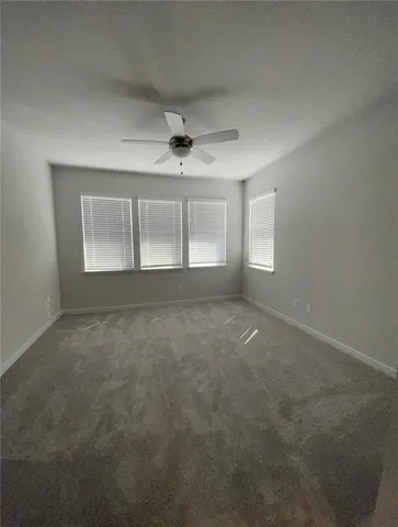 a bathroom with a shower a sink and mirror