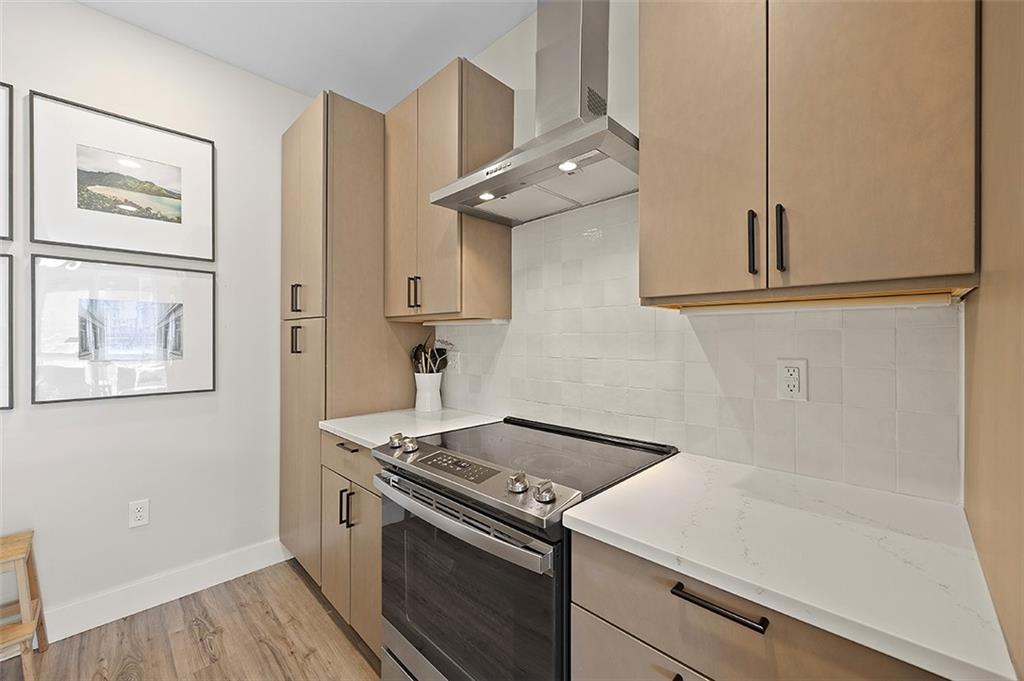 3725 Butler Street, Unit 302 Pittsburgh, PA 15201 - Photo 11 of 44 a kitchen with a stove and a microwave