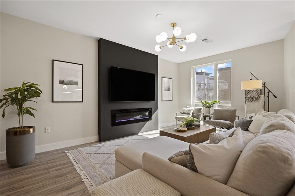 3725 Butler Street, Unit 302 Pittsburgh, PA 15201 - Photo 14 of 44 a living room with furniture and a flat screen tv