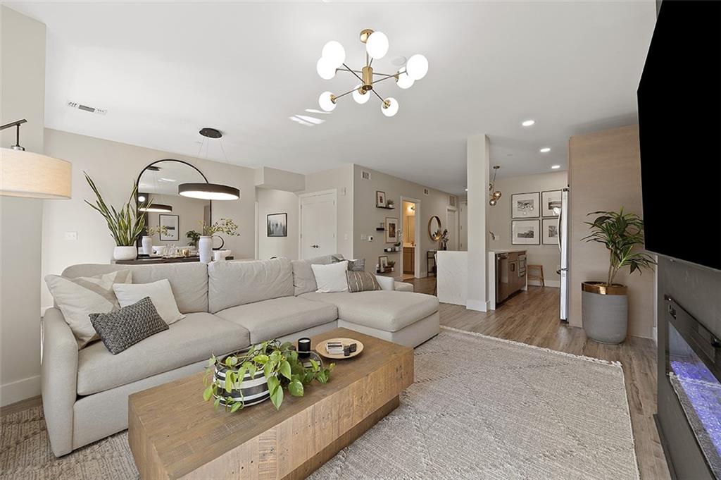 3725 Butler Street, Unit 302 Pittsburgh, PA 15201 - Photo 17 of 44 a living room with furniture and a flat screen tv