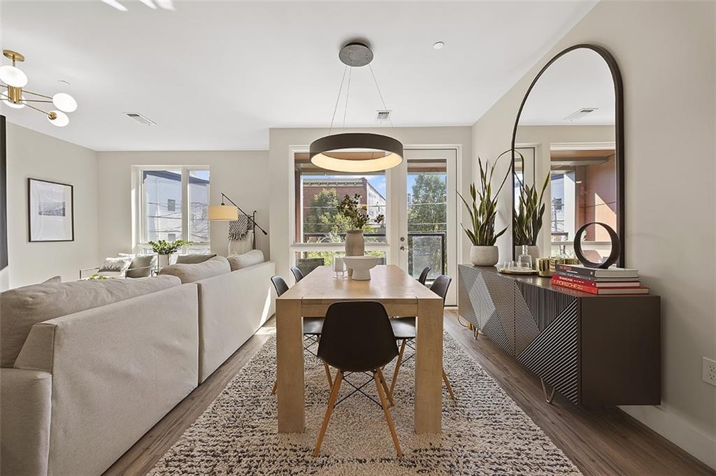 3725 Butler Street, Unit 302 Pittsburgh, PA 15201 - Photo 19 of 44 a living room with furniture a rug and a large window