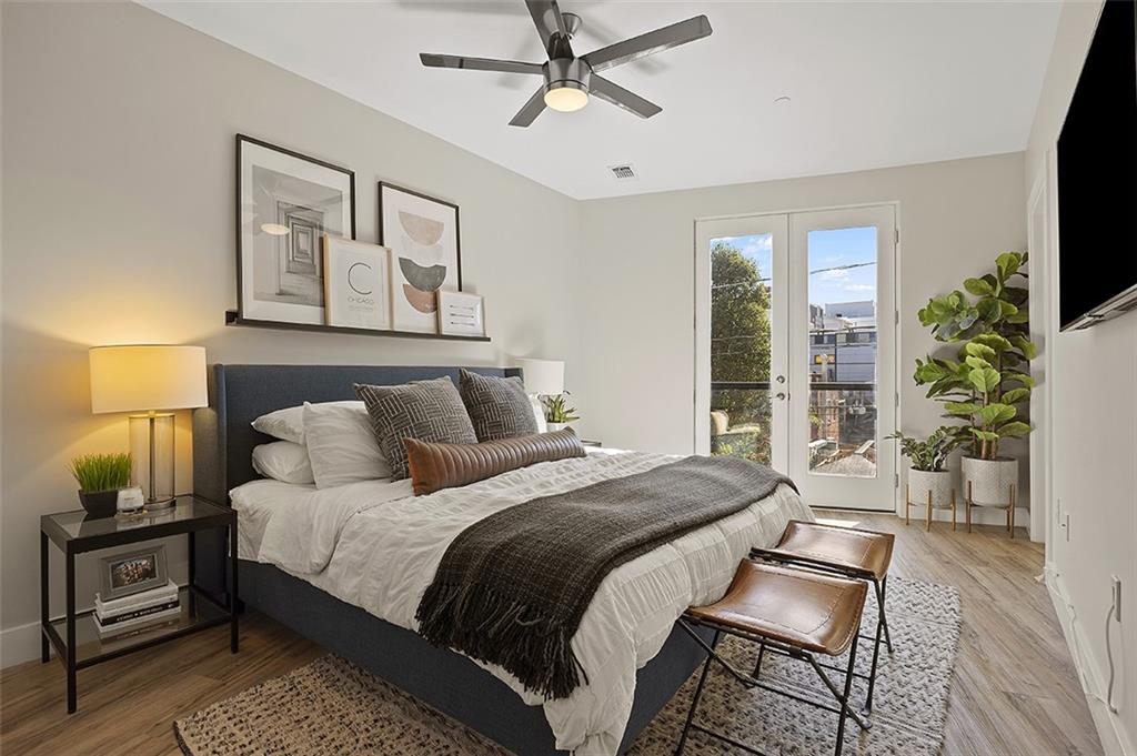 3725 Butler Street, Unit 302 Pittsburgh, PA 15201 - Photo 26 of 44 a bedroom with a bed a couch and large window