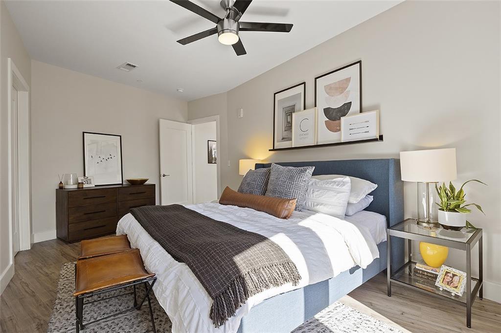 3725 Butler Street, Unit 302 Pittsburgh, PA 15201 - Photo 27 of 44 a bedroom with a bed and wooden floor