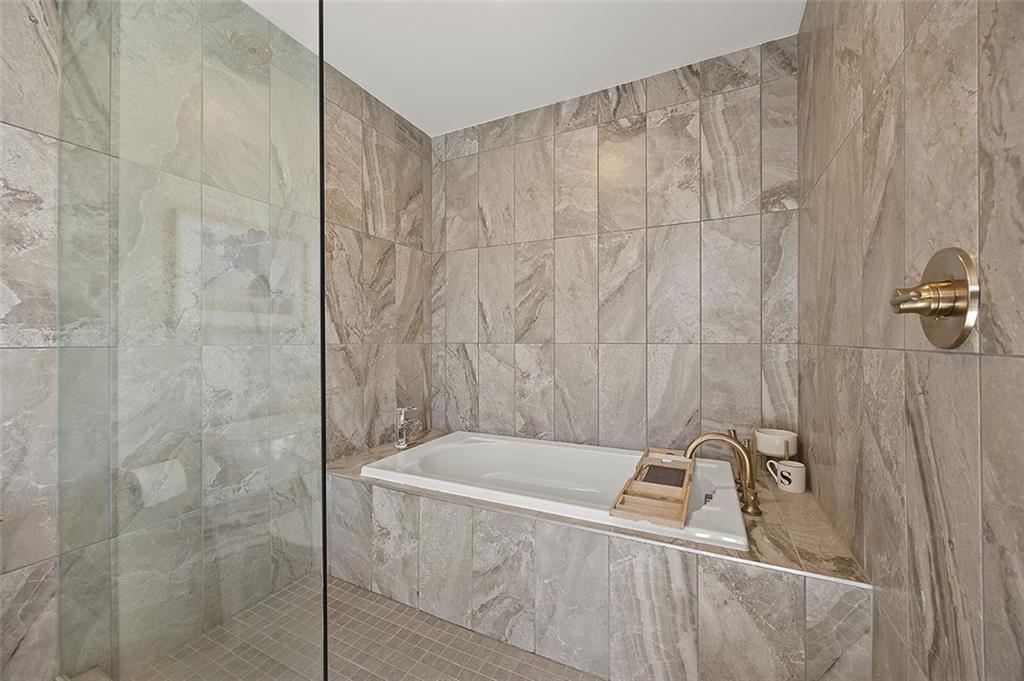 3725 Butler Street, Unit 302 Pittsburgh, PA 15201 - Photo 29 of 44 a bathroom with a sink a bath tub and shower