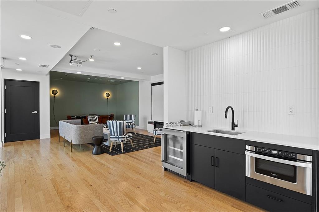 3725 Butler Street, Unit 302 Pittsburgh, PA 15201 - Photo 35 of 44 a large kitchen with stainless steel appliances a large counter top