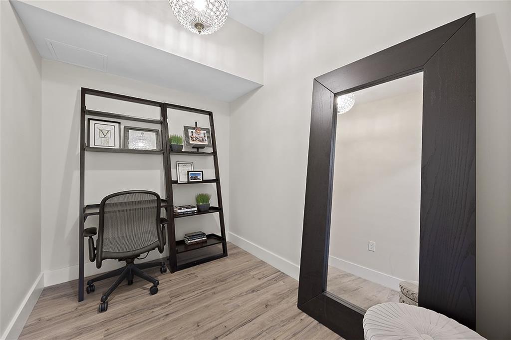 3725 Butler Street, Unit 302 Pittsburgh, PA 15201 - Photo 4 of 44 a view of a workspace with wooden floor and furniture