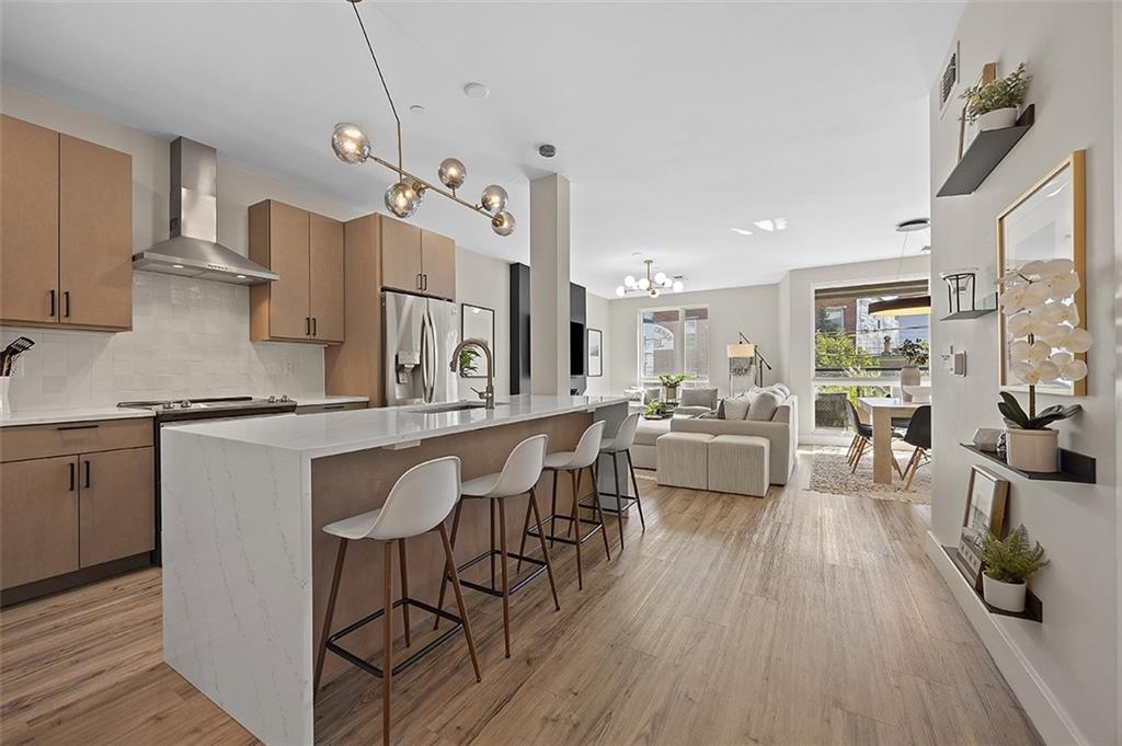 3725 Butler Street, Unit 302 Pittsburgh, PA 15201 - Photo 7 of 44 a large kitchen with granite countertop lots of counter space and stainless steel appliances