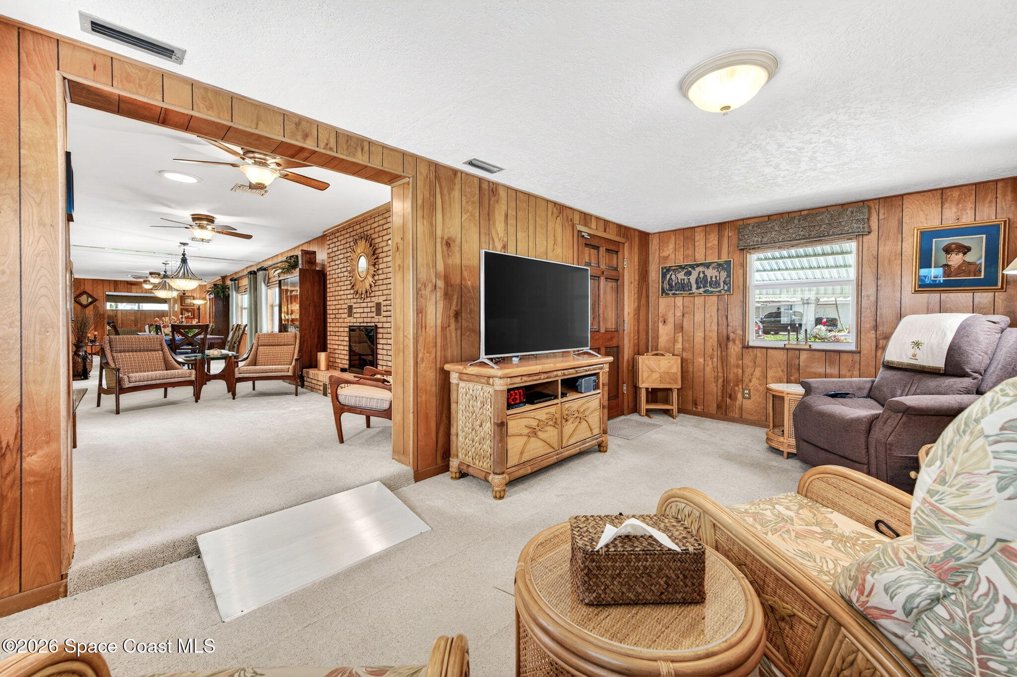 935 Samar Road Cocoa Beach, FL 32931 - Photo 4 of 22 a living room with furniture and a flat screen tv