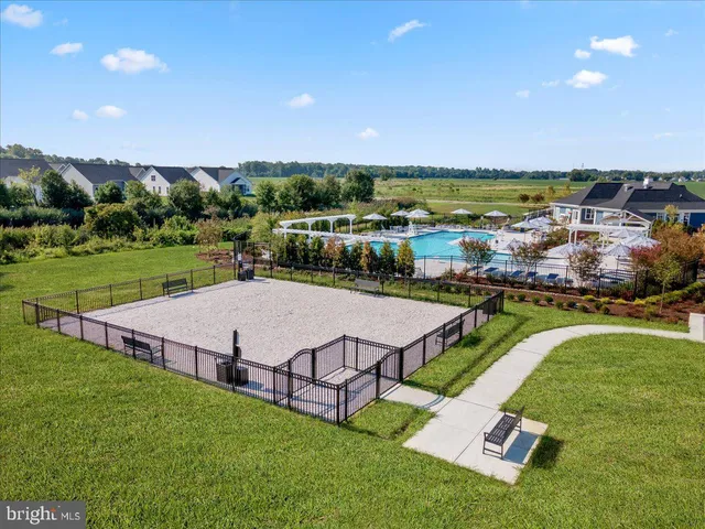 an aerial view of a house with a big yard
