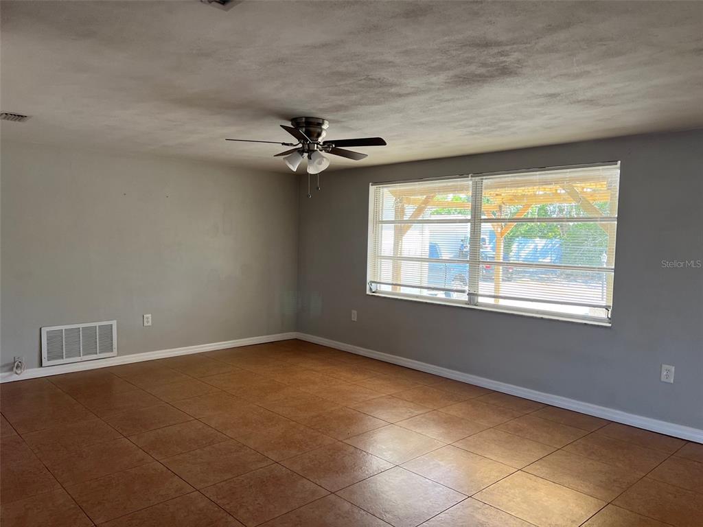 7835 Arbordale Drive Port Richey, FL 34668 - Photo 14 of 21 a view of an empty room with a window
