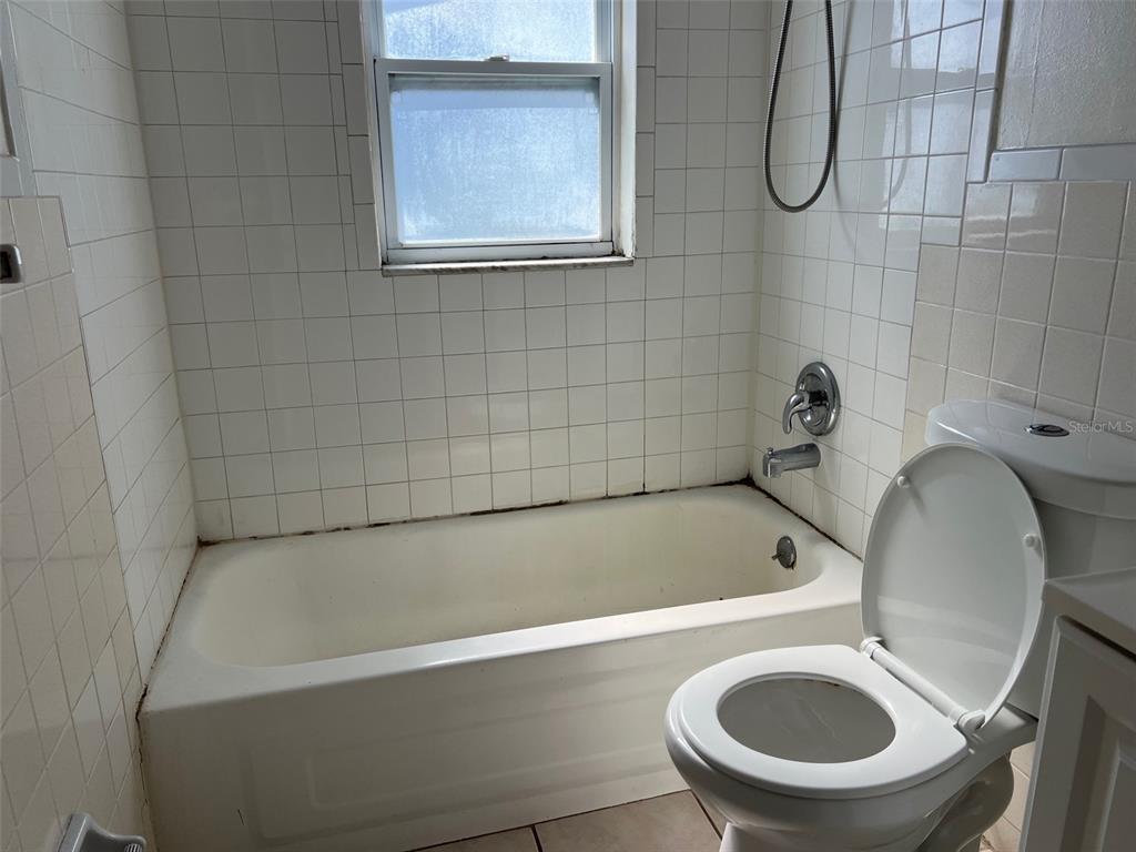 7835 Arbordale Drive Port Richey, FL 34668 - Photo 21 of 21 a bathroom with a sink a toilet and a bathtub