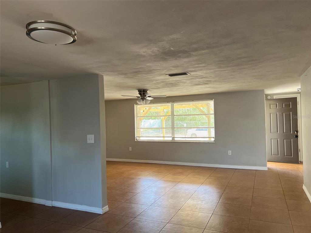 7835 Arbordale Drive Port Richey, FL 34668 - Photo 7 of 21 an empty room with windows