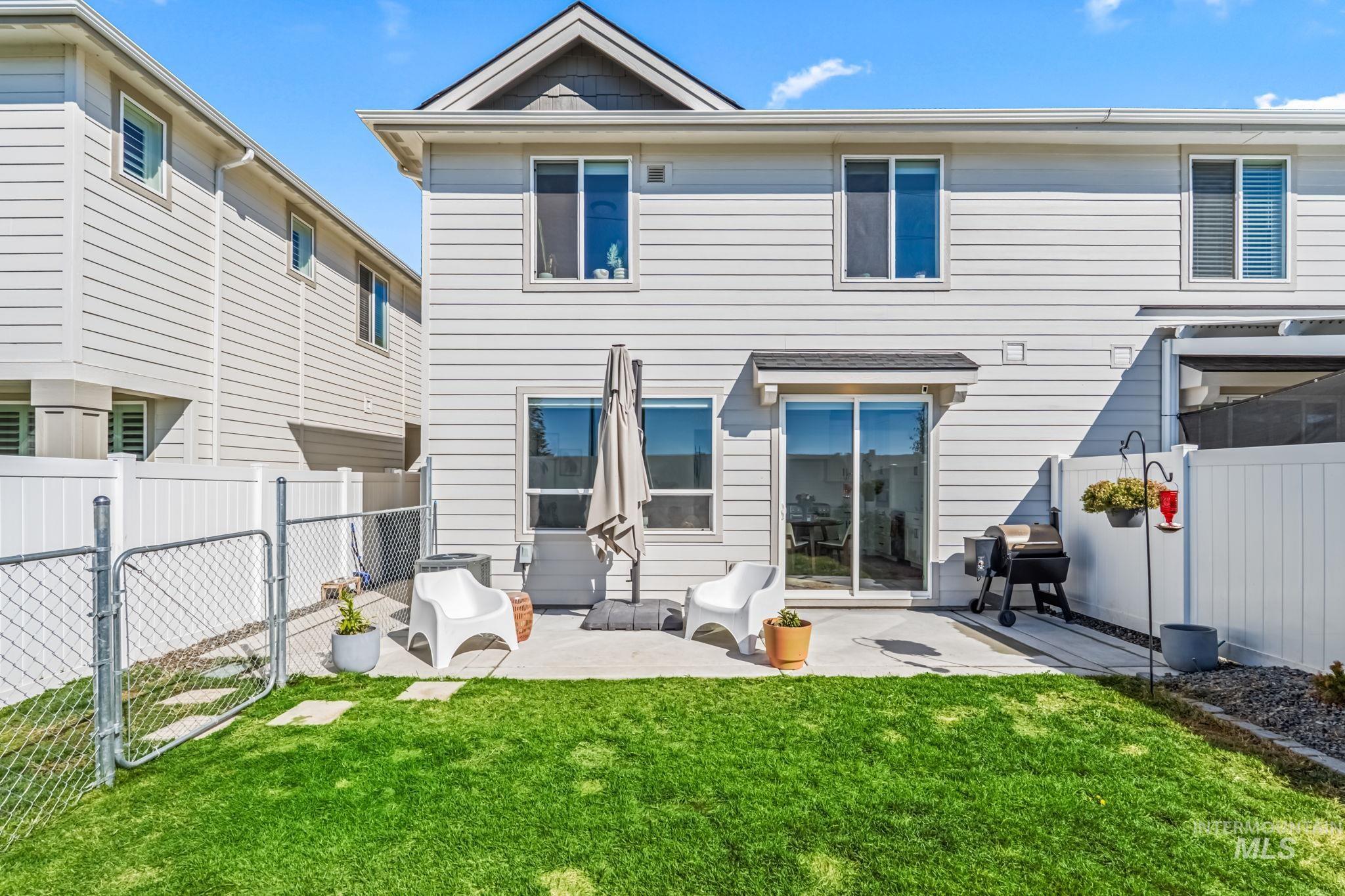 4637 West Riva Capri Street Meridian, ID 83646 - Photo 38 of 48 Back of property featuring a fenced backyard, a patio, and a gate