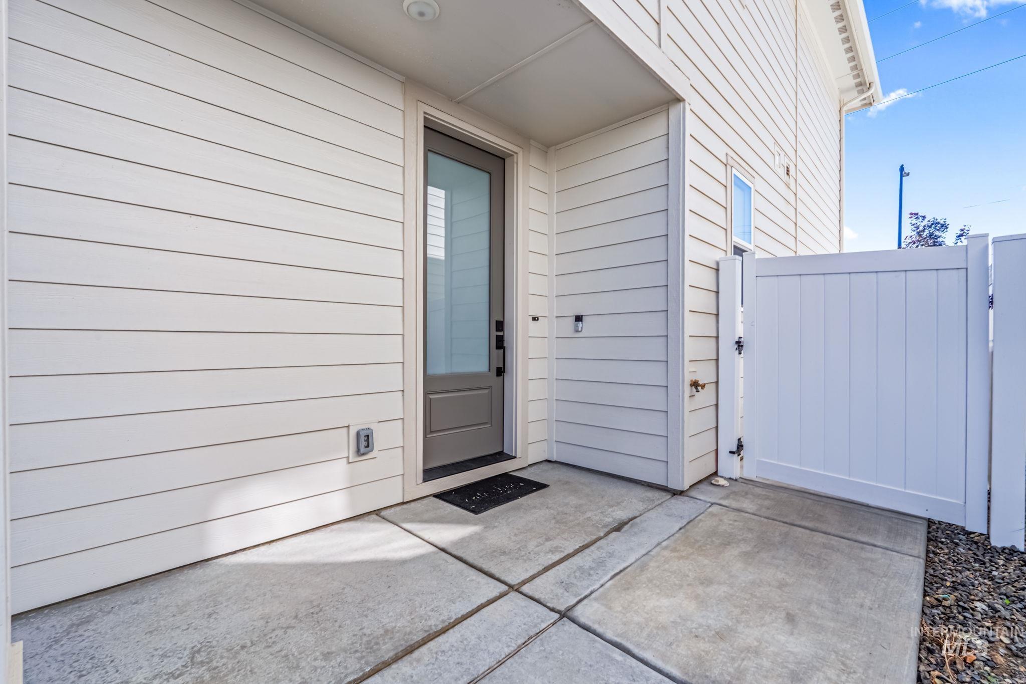 4637 West Riva Capri Street Meridian, ID 83646 - Photo 4 of 48 View of exterior entry with a gate